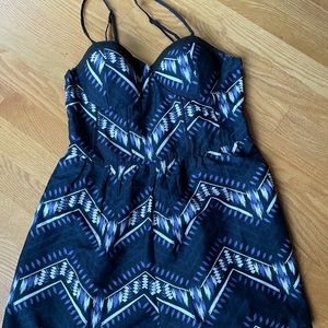 Patterned padded romper. No tags but never worn. Adjustable straps.